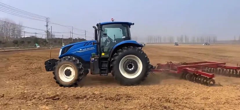 Tractor working in a field as an agricultural auto-steering application example